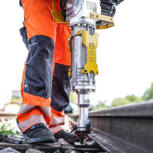 photo of man using the Robel Battery Powered Spike Driver