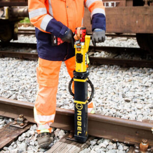 photo of a man using the Robel Battery Powered Spike Puller - RoxTract B 33.20